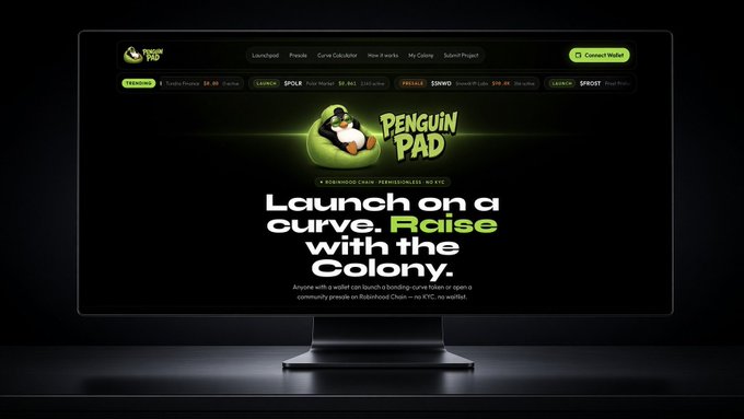 A computer monitor displaying the PenguinPad website with the headline 'Launch on a curve. Raise with the Colony.' featuring a penguin mascot logo.