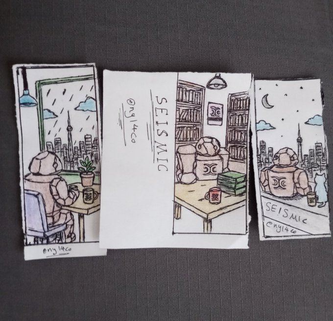 Three small hand-drawn illustrations on white paper featuring a robot in cozy settings (by a rainy window, in a library, on a rooftop at night with a cat), all signed 'eng14co' with 'SEISMIC' text.