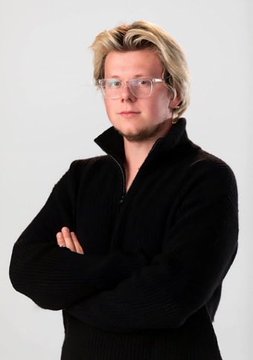 A portrait shows Erik Finman, a young blond man wearing glasses and a black zip-up sweater, standing with his arms crossed against a plain white background. The accompanying text recounts his story of investing his grandmother’s $1,000 in Bitcoin in 2012 at roughly $10–$12 per coin.
