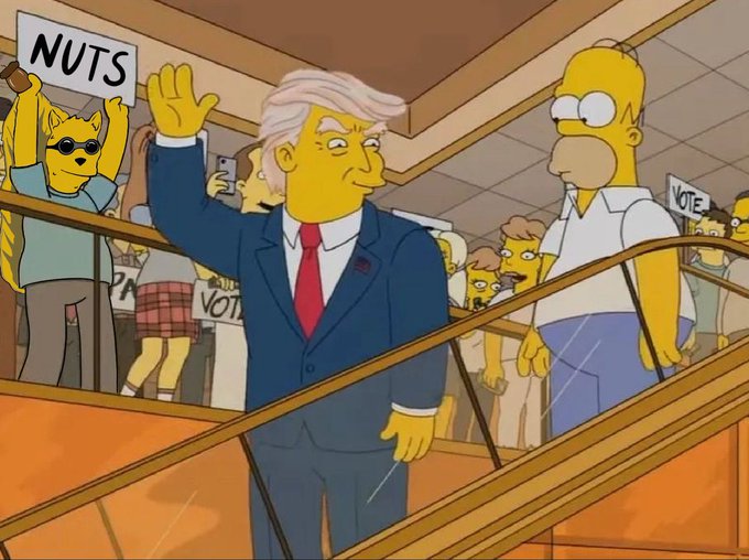 An image from The Simpsons showing a Donald Trump caricature in a blue suit waving on an escalator, with Homer Simpson standing nearby and onlookers holding "NUTS" and "VOTE" signs.