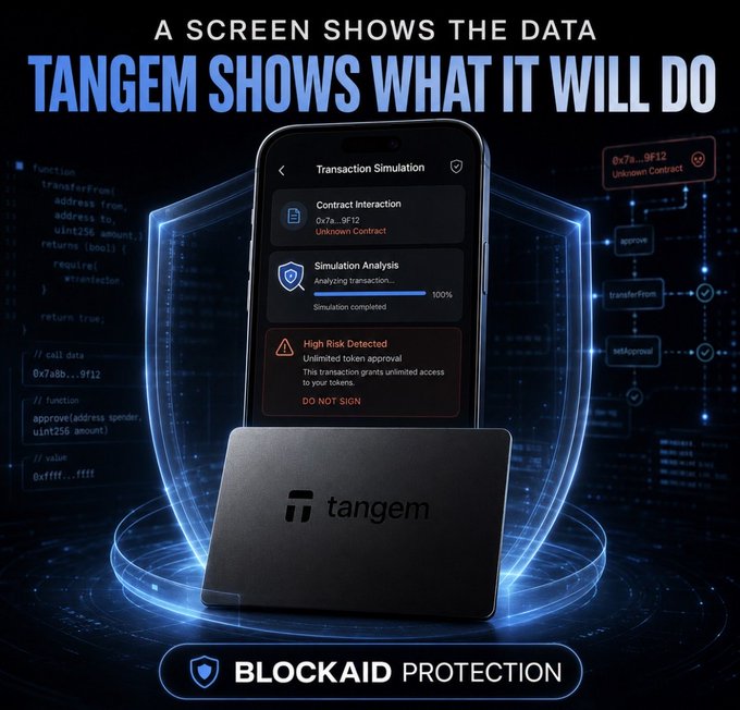 An advertisement featuring 'TANGEM SHOWS WHAT IT WILL DO' with a phone displaying transaction simulation and 'BLOCKAID PROTECTION' text, alongside a black Tangem hardware wallet.