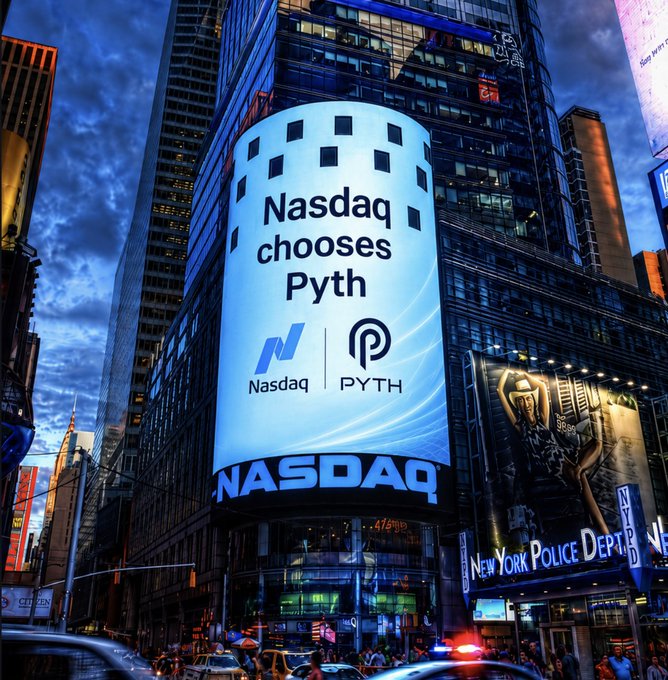 A photograph of the Nasdaq building in Times Square displaying a large billboard announcing 'Nasdaq chooses Pyth' with the Nasdaq and Pyth logos.