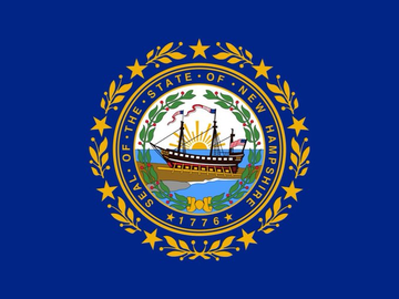 The image shows the flag of the State of New Hampshire, featuring a blue field with the state seal depicting a ship, the date "1776," and the text "SEAL OF THE STATE OF NEW HAMPSHIRE." This flag directly relates to the news about New Hampshire's $100 million Bitcoin-backed municipal bond awaiting Executive Council approval.