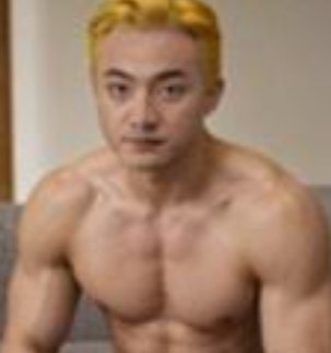 A shirtless man with short blonde hair, a mustache, and a muscular build, appearing to be from a low-resolution video clip.