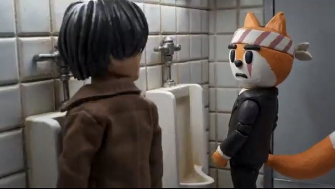 Two stop-motion figures—a person with black hair in a brown coat and an anthropomorphic fox wearing a striped headband and black jacket—stand facing each other in a tiled restroom, with the fox displaying a worried expression. The scene, featuring a urinal and industrial plumbing fixtures, parodies the "To infinity and beyond" mantra by humorously reframing an epic catchphrase around a far less glamorous bathroom encounter.