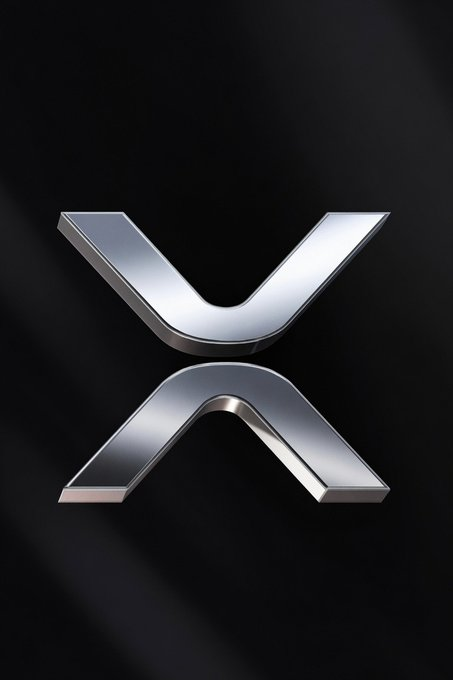 The image features a sleek, metallic 3D representation of the XRP logo (a stylized "X" symbol) set against a dark background. This visual ties directly to the post's announcement of $15.63M in spot ETF inflows for $XRP, with the prominent logo emphasizing the cryptocurrency's brand alongside its growing ETF assets now totaling $934.26M.