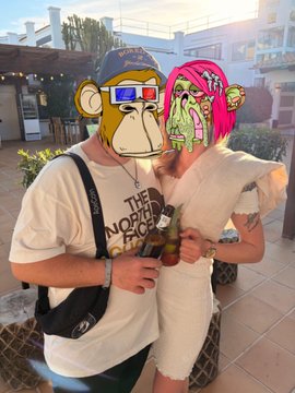 A casual photo of a couple posing together outdoors, both wearing 3D-anaglyph style monkey filters on their faces, with the man holding a drink.