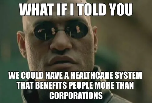 The image features an older man wearing sunglasses, possibly a character from a movie or TV show. The caption of the image reads "What if I told you we could have a healthcare system that benefits people more than corporations." This statement seems to be related to the main subject in the image and is likely meant as a humorous response to the post about the healthcare system.