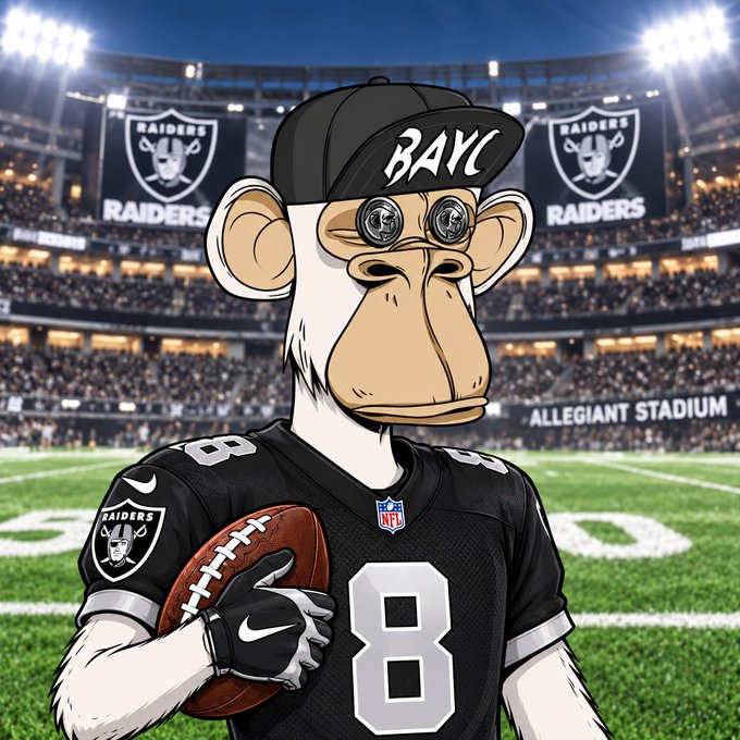 A cartoon Bored Ape Yacht Club (BAYC) NFT character wearing a black cap labeled "BAYC," round reflective sunglasses, and a Las Vegas Raiders jersey with the number 8, holding a football inside Allegiant Stadium with Raiders logos displayed on the jumbotron—blending the user's BAYC identity with their NFL team fandom.