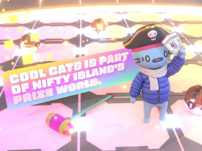 A cheerful blue cat character wearing a pirate hat and puffy jacket holds up a trading card, standing next to a colorful hammer in a glowing arena, with text reading "COOL CATS IS PART OF NIFTY ISLAND'S PRIZE WORLD." The image illustrates the post's announcement of Nifty Island's new Prize World feature, highlighting Cool Cats' involvement in the trading card collectible experience.