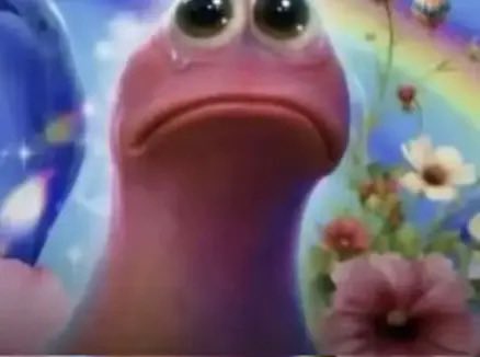 A sad pink animated character with big eyes cries against a colorful, dreamy background with flowers and sparkles.