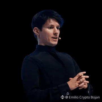 A man with dark hair wearing a black turtleneck is speaking and gesturing with his hands, with a watermark '@Emilio Crypto Bojan' at the bottom right.