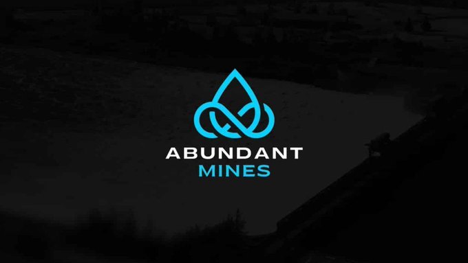 The image features a logo for an online platform called "AbundantMines" that offers Bitcoin mining services. The logo consists of a blue water droplet with a looped line, symbolizing the continuous flow of Bitcoins being mined. The website address is provided in the bottom right corner of the image.