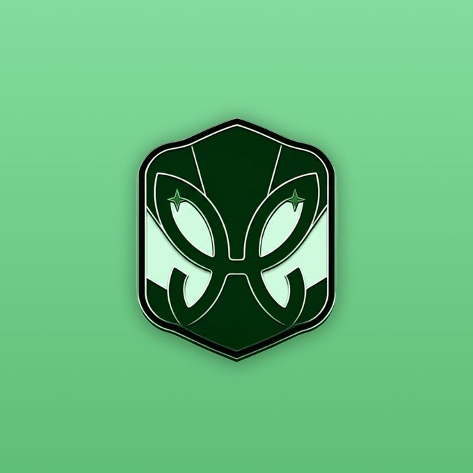 The image features a green shield with two butterfly designs, one on each side of a black border. The butterflies are depicted as white with black outlines, giving them a stylized appearance. The background color is a light green hue that complements the overall design. The caption below the image reads "A SBT for Karma believers: engage.tbook.com/tbook-communit". This suggests that the butterfly shield might be related to a spiritual or religious theme, possibly symbolizing protection and guidance in one's journey through life.