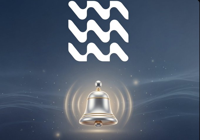 An Aquarius (water-bearer) zodiac symbol displayed above a glowing silver and gold bell against a dark starry night background.