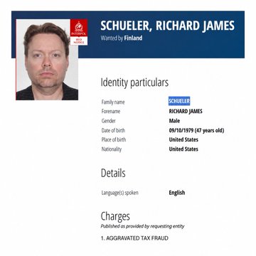 An Interpol Red Notice for Richard James Schueler, listing his date of birth as 09/10/1979 and nationality as United States, with charges of aggravated tax fraud, shown as he was reportedly detained in Istanbul per the accompanying post.