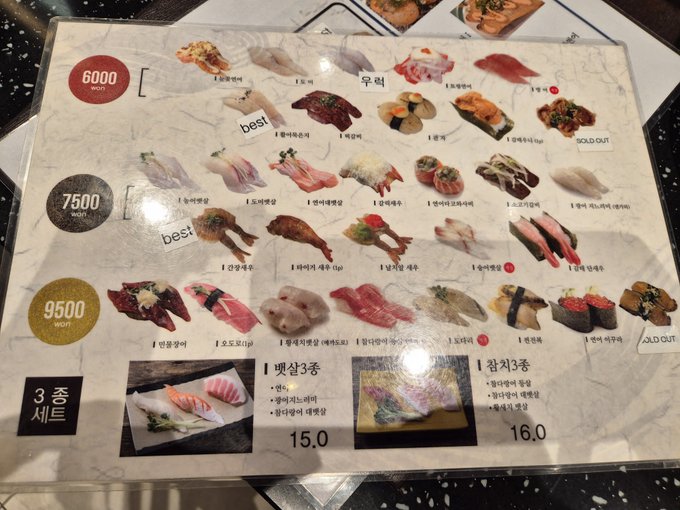 A Korean sushi menu displays 3-course sets at 6,000w, 7,500w, and 9,500w, featuring various sushi options with some marked 'best' and 'SOLD OUT'.