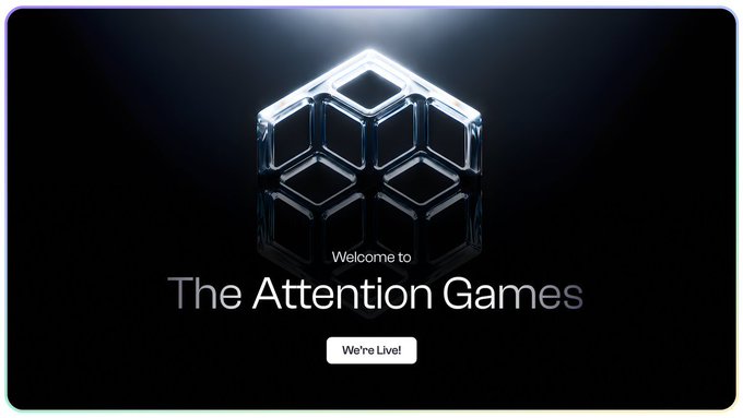 A welcome screen for 'The Attention Games' featuring a translucent 3D cube against a dark background with a 'We're Live!' button.