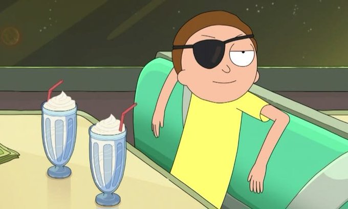 An animated character (Morty from Rick and Morty) wearing an eyepatch and yellow shirt, sitting in a diner booth next to two milkshakes with a space view in the background.