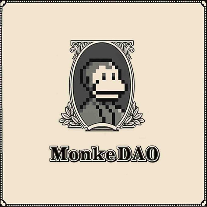 A vintage-style emblem featuring a pixelated monkey face with the text 'MonkeDAO' below it on a cream-colored background with a decorative border.