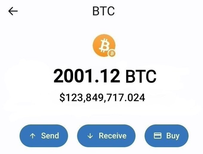 A screenshot of a Bitcoin wallet displaying a balance of 2001.12 BTC valued at $123,849,719.024, with Send, Receive, and Buy options. The image is used to lend false credibility to a giveaway scam claiming the user will send $645 in Bitcoin to those who retweet and comment "BTC."