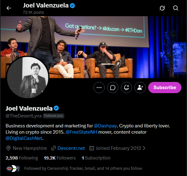A Twitter profile for Joel Valenzuela (@TheDesertLynx), with 19.2K followers and a bio mentioning his work at Dashpay and living on crypto since 2015, shows him standing on stage at what appears to be a crypto conference. The "Live in three hours" caption likely refers to an upcoming livestream event he is about to host.