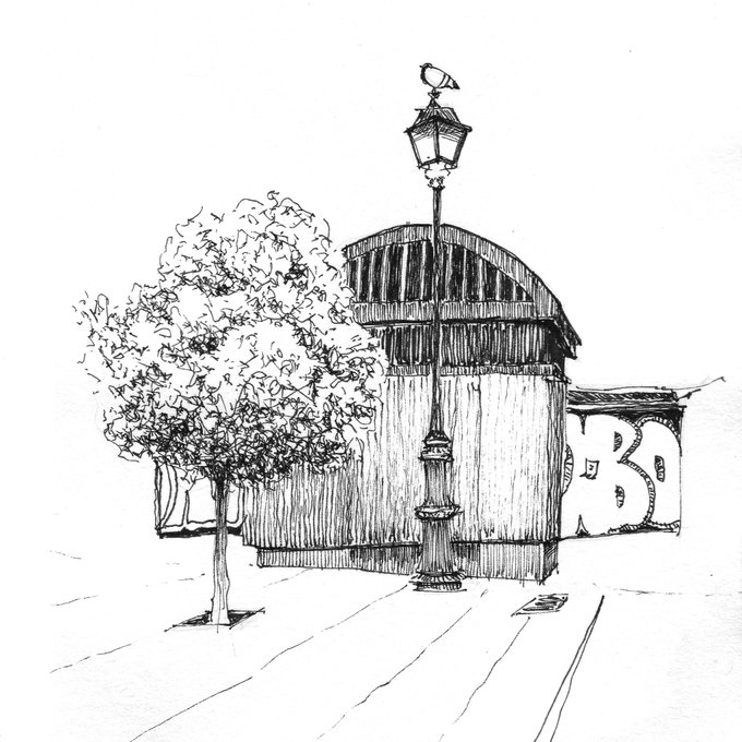 A pen-and-ink sketch of a street scene featuring a tree, an ornate lamppost topped with a bird, and a structure with the letter 'B' visible.