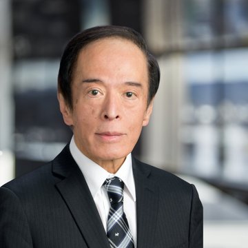A man in a dark suit and patterned tie poses for a professional headshot against a blurred background. The accompanying post about the BIS Chair appointment and XRP's reclassification suggests this is Kazuo Ueda, Governor of the Bank of Japan.
