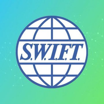 The image displays the SWIFT logo, featuring the letters "S.W.I.F.T." prominently across a globe icon, set against a blue-to-green gradient background with subtle network lines. The logo represents SWIFT's adoption of blockchain technology, which the post highlights by noting how Citi and DBS used SWIFT's new ledger to settle tokenized bank deposits between Singapore and the U.S. in minutes rather than the typical two business days.