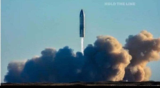 A rocket launches into a blue sky, leaving a trail of smoke and fire, with the text 'HOLD THE LINE' displayed in the upper right corner.
