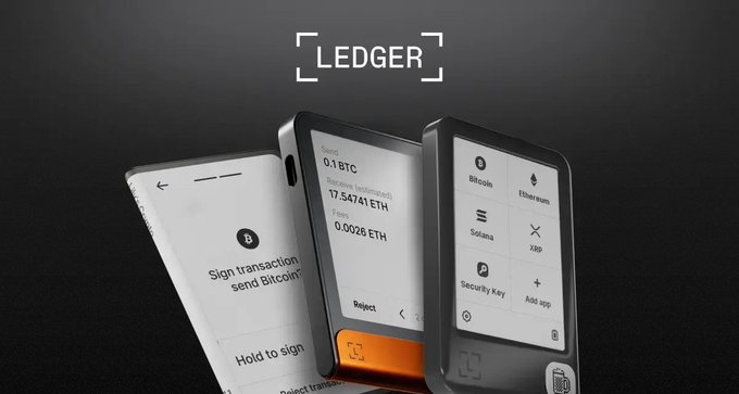 A Ledger advertisement showcases three hardware wallets displaying cryptocurrency transaction screens with text including 'Sign transaction, send Bitcoin', '0.1 BTC', '17.54741 ETH', and 'Security Key'.