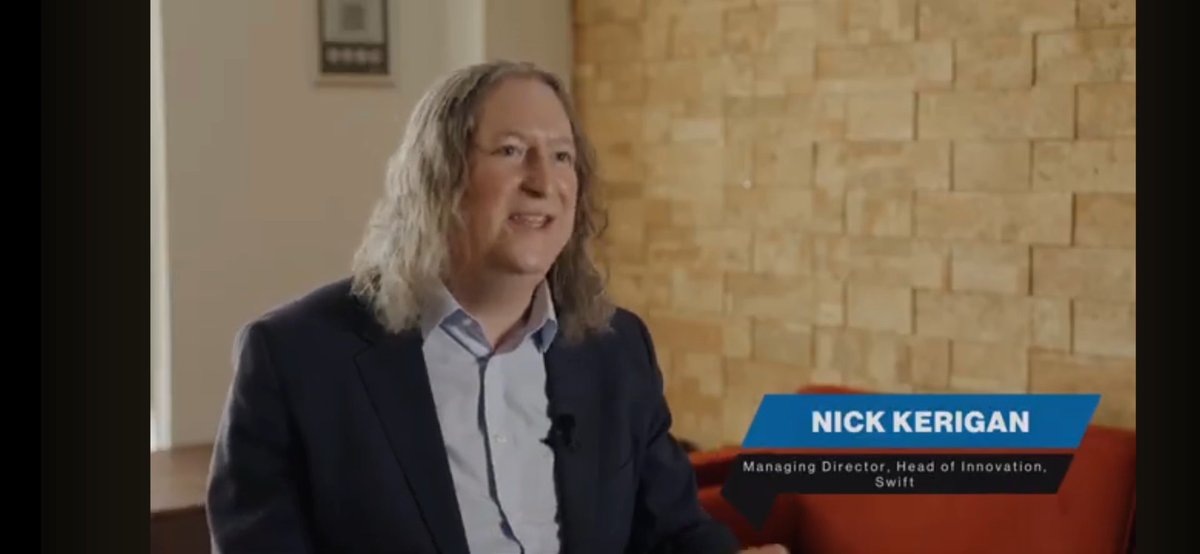 Nick Kerigan, Managing Director and Head of Innovation at SWIFT, speaks during an interview about digital assets, interoperability, and seamless multi-network functionality, with a lower-third graphic identifying him by name and title.
