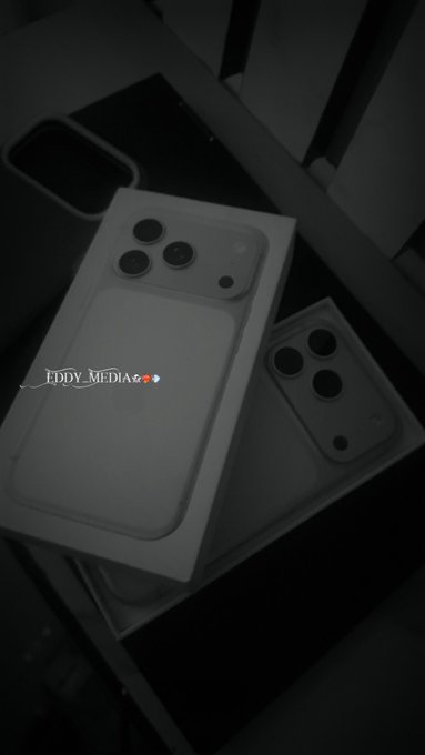 A black and white photo of two smartphone boxes featuring camera module designs, with a watermark reading 'EDDY_MEDIA'.