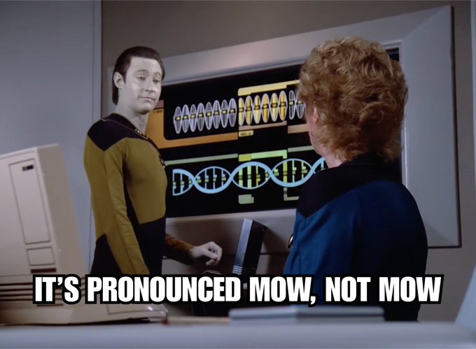 A Star Trek: The Next Generation meme featuring Data looking at another character in front of a science display, with the caption 'IT'S PRONOUNCED MOW, NOT MOW.'
