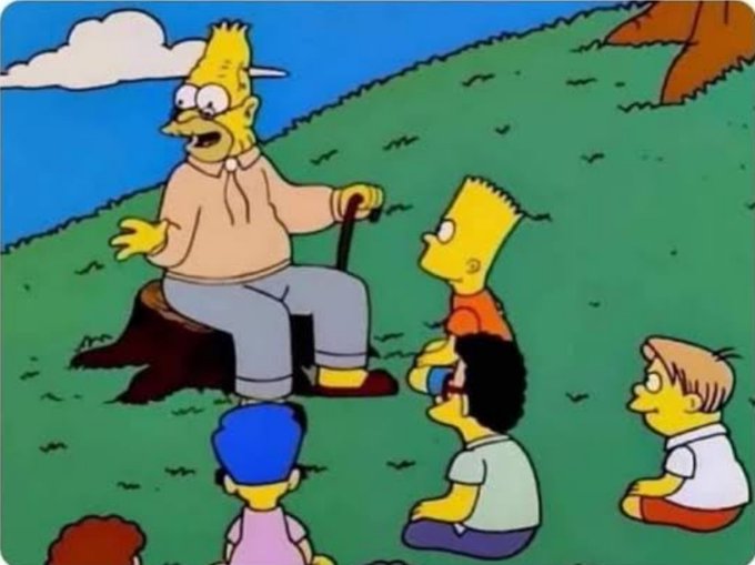 A scene from The Simpsons showing an elderly man sitting on a stump holding a cane, telling a story to Bart and other children sitting on the grass.