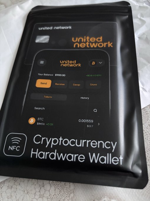 A black resealable package for a 'United Network' Cryptocurrency Hardware Wallet, showing the app interface on the front with a $900.00 balance and NFC capability.