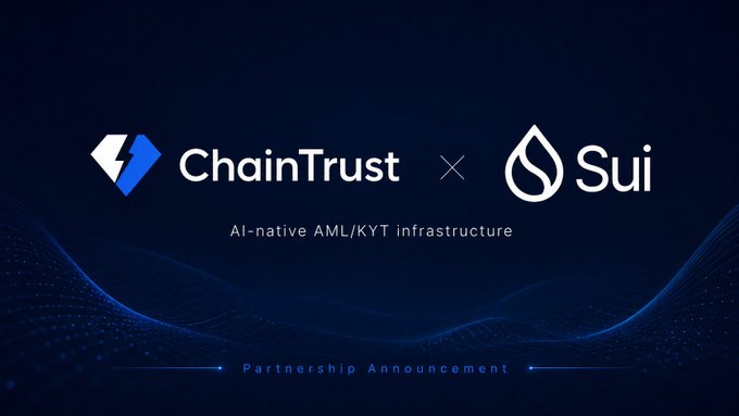 The image features a logo for ChainTrust and a partnership announcement between them and the Sui Foundation. The logo displays two blue diamonds with white text that reads "chaintrust x Sui". Below this, there's a caption stating "Safer applications, smoother payment processes." This suggests that the partnership aims to provide enhanced security and efficiency in financial transactions for users of the Sui Foundation's platform.