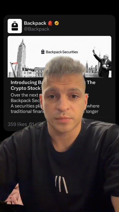 The image shows a man wearing a black t-shirt, sitting at a desk with his face displayed on a computer screen. The background of the image features a city skyline, suggesting that he might be in an urban setting or working from home. On the computer screen, there is a message about trading real US stocks through Backpack Securities and how to do it.