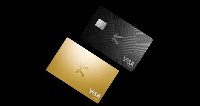 Two sleek KAST cards, one gold and one black with an EMV chip, displayed against a black background with "VISA" and "DEBIT" branding visible.

The image showcases KAST's branded Visa debit cards, which visually represent the post's theme of using crypto directly for everyday purchases—turning digital assets into a tangible payment method for real-world transactions like buying a meal.