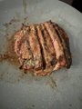 A score of raw ground meat sits on parchment paper, juxtaposing the grueling physical effort of 150 daily push-ups with the disciplined goal of accumulating 1 BTC (100,000,000 sats). The protein-rich meal symbolizes the "stack muscle" foundation fueling the creator's relentless grind toward their $150,000 Bitcoin price target.
