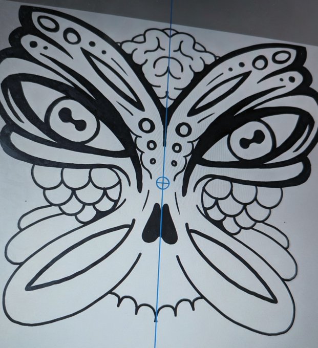 A symmetrical black-and-white tattoo-style illustration of a butterfly-skull hybrid with a central blue vertical alignment line on a screen, likely for a CNC or laser cutting design.