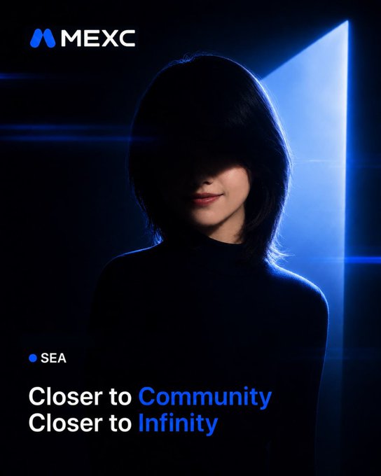 The image features a woman with short hair wearing a black top, standing against a dark background that includes blue lights. The text "Close to Community" is written above her head, while "Closer to Infinity" is below her. This suggests that she might be participating in an event or discussion related to the concept of community and infinity.