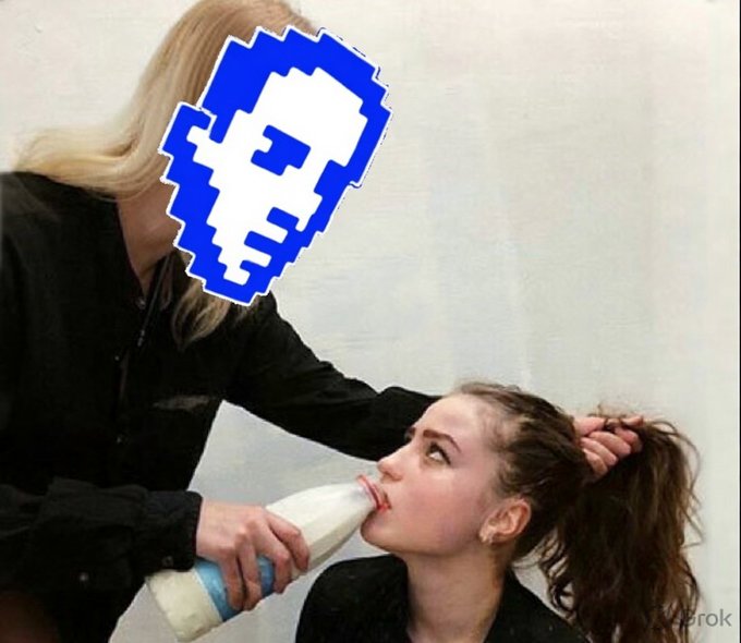A pixelated blue and white blocky character face is overlaid on a photo of a blonde person holding a milk bottle to another person's mouth.
