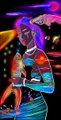 A blurry image shows a performer with brightly colored clothing and multicolored body paint standing in front of a dark background with colorful lights.