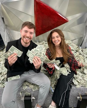 A photo of MrBeast (Jimmy Donaldson) and a woman sitting on stairs covered in cash, both smiling and holding up fans of dollar bills, with a large red YouTube play button plaque behind them.