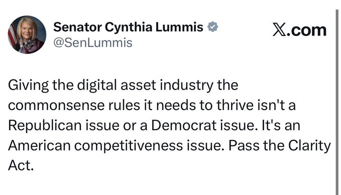 The image shows a white piece of paper with black text that reads "CLARITY ACT INCOMING $XRP". This message appears to be related to the post about Cynthia Lummis, as indicated by the caption provided. The focus on this message suggests that it is an important issue or development in the context of the post's content.
