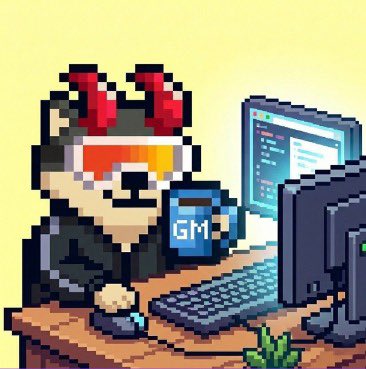 A pixel art image of a character with red horns wearing orange sunglasses, sitting at a computer desk with a mug labeled 'GM'.