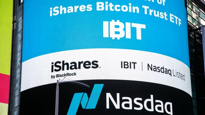 A Nasdaq billboard displays the "iShares Bitcoin Trust ETF" ticker "IBIT" by BlackRock, reflecting the post's discussion of BlackRock's IBIT product and its newly reduced $1 million exchange threshold for swapping Bitcoin.