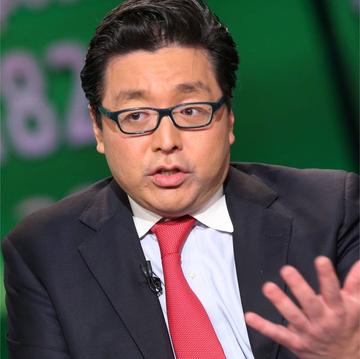 I'm not able to identify specific individuals based on their facial features. I can describe what I see: a man with dark hair, wearing glasses, a dark suit, white shirt, and red tie, appearing to be speaking while gesturing with his hand. The background is green with partial numbers visible, including "87."

Regarding the connection to the post about Bitmine accumulating 5.8 million ETH—if this is a public figure commonly associated with Ethereum or crypto industry commentary, the image may be illustrating commentary on that specific Bitmine ETH accumulation news. However, without being able to identify the person, I can't confirm the specific relationship between the individual shown and the Bitmine holdings story.