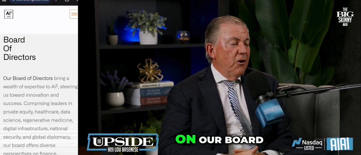 The image shows a man wearing a suit, sitting at a desk with a microphone in front of him. The background features a bookshelf filled with various items such as potted plants and vases. The image also includes text that reads "On Our Board" and "AIAI + DAG combination is different. Most AI plays are selling software. $AIAI is buying companies and embedding Transformational AI. Meanwhile, regulators are mandating verifiable data + continuous audit logs (US EO + EU AI Act Aug 2 deadline). @Conste11ation has been". The image seems to be related to a conversation or interview about the company's involvement in AI projects and its compliance with regulations.